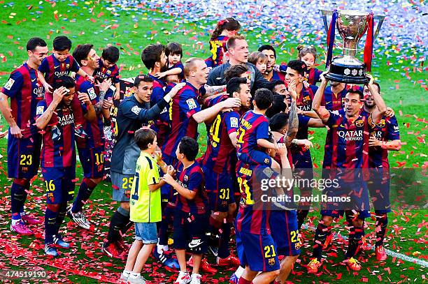 Barcelona players celebrate with La Liga trophy at the end of the La Liga match between FC Barcelona and RC Deportivo de la Coruna at Camp Nou on May...