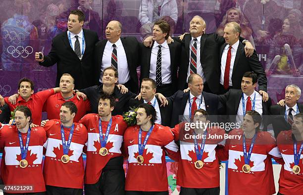 Assistant coach Claude Julien and head coach Mike Babcock of Canada look on during the medal ceremony of the Men's Ice Hockey Gold Medal match...