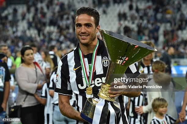 Alessandro Matri of Juventus FC celebrates with the Serie A Trophy at the end of the Serie A match between Juventus FC and SSC Napoli at Juventus...