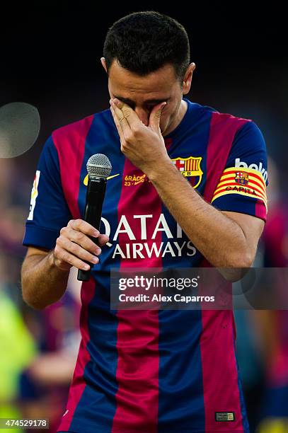 Xavi Hernandez of FC Barcelona cries as he speaks to the spectators after the La Liga match between FC Barcelona and RC Deportivo La Coruna at Camp...