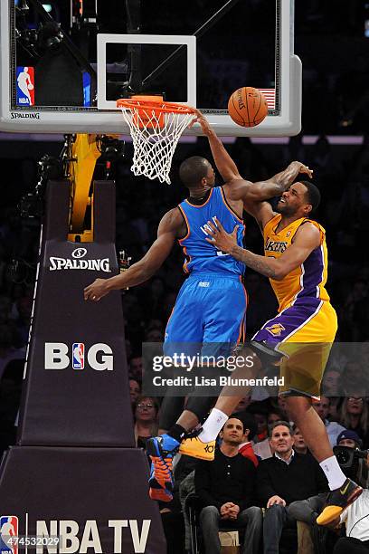 Shawne Williams of the Los Angeles Lakers puts a shot up against Serge Ibaka of the Oklahoma City Thunder at Staples Center on February 13, 2014 in...