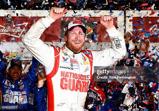 Dale Earnhardt Jr., driver of the National Guard Chevrolet, celebrates in Victory Lane after winning the NASCAR Sprint Cup Series Daytona 500 at...