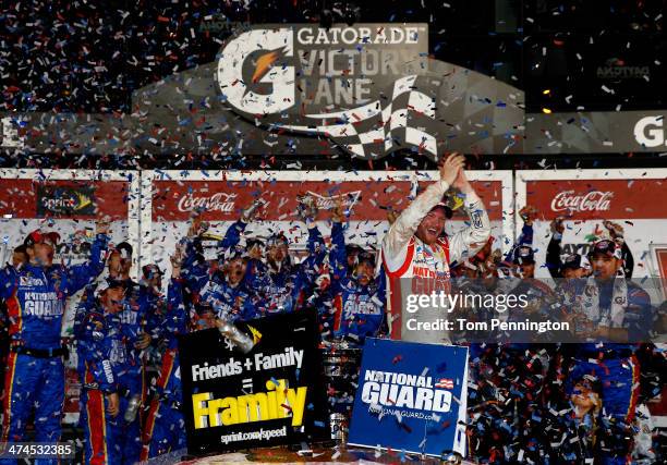 Dale Earnhardt Jr., driver of the National Guard Chevrolet, celebrates in Victory Lane after winning the NASCAR Sprint Cup Series Daytona 500 at...