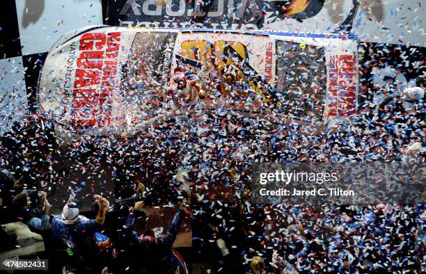 Dale Earnhardt Jr., driver of the National Guard Chevrolet, celebrates in Victory Lane after winning the NASCAR Sprint Cup Series Daytona 500 at...