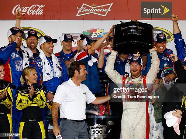 Dale Earnhardt Jr., driver of the National Guard Chevrolet, celebrates in Victory Lane with the the Harley J. Earl trophy after winning the NASCAR...