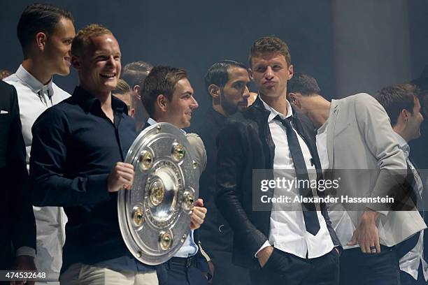 Sebastian Rode holds the German Championship winners trophy as he arrives with his team mates for the FC Bayern Muenchen Bundesliga Champions Dinner...