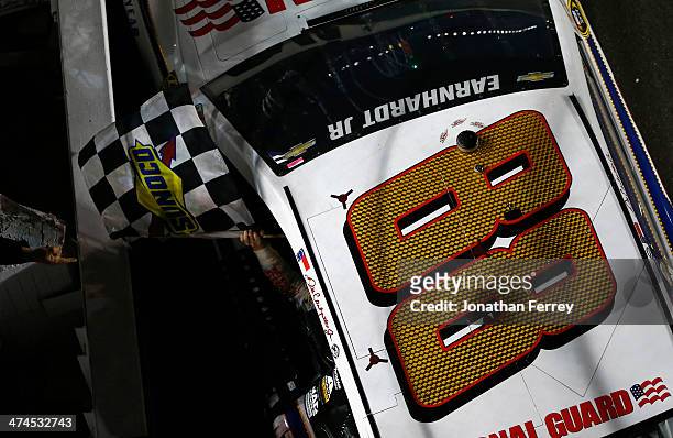 Dale Earnhardt Jr., driver of the National Guard Chevrolet, celebrates with the checkered flag after winning the NASCAR Sprint Cup Series Daytona 500...