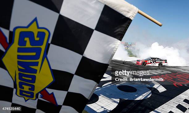 Austin Dillon, driver of the Rheem Chevrolet, celebrates with a burnout after winning the NASCAR XFINITY Series Hisense 300 at Charlotte Motor...