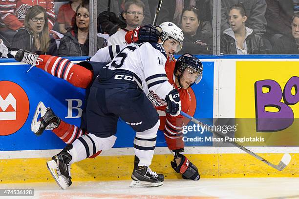 Anthony Deluca of the Rimouski Oceanic checks Stephen Desrocher of the Oshawa Generals in Game Two during the 2015 Memorial Cup at the Pepsi Coliseum...