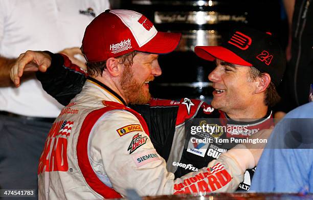 Dale Earnhardt Jr., driver of the National Guard Chevrolet , celebrates with Jeff Gordon, driver of the Drive To End Hunger Chevrolet, in victory...