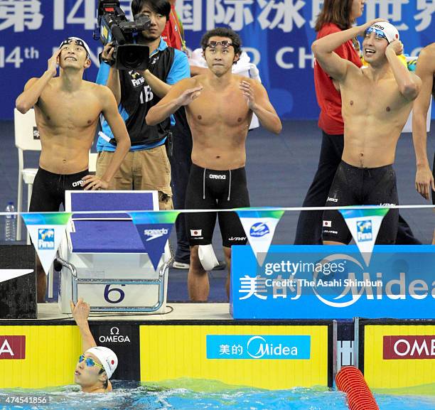 Ryosuke Irie , Kosuke Kitajima , Takuro Fujii and Shogo Hihara react after competing in the Men's 400m Medley Relay final during Day sixteen of the...