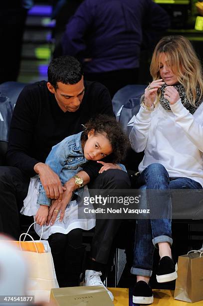 Chris Ivery, Stella Luna Ivery and Ellen Pompeo attend a basketball game between the Brooklyn Nets and the Los Angeles Lakers at Staples Center on...