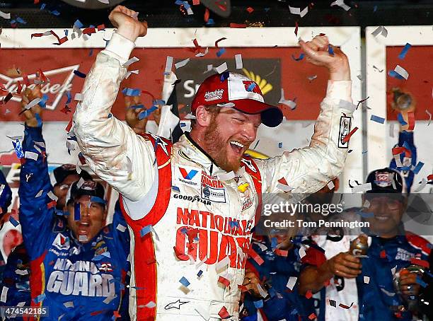 Dale Earnhardt Jr., driver of the National Guard Chevrolet, celebrates in Victory Lane after winning during the NASCAR Sprint Cup Series Daytona 500...