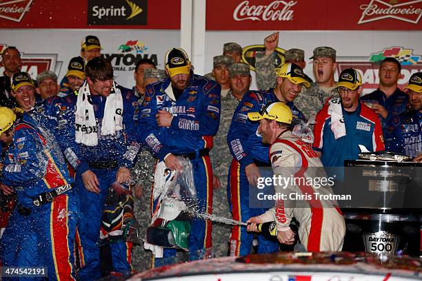 Dale Earnhardt Jr., driver of the National Guard Chevrolet, celebrates in Victory Lane after winning during the NASCAR Sprint Cup Series Daytona 500...