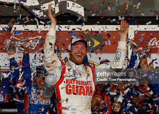 Dale Earnhardt Jr., driver of the National Guard Chevrolet, celebrates in Victory Lane after winning during the NASCAR Sprint Cup Series Daytona 500...