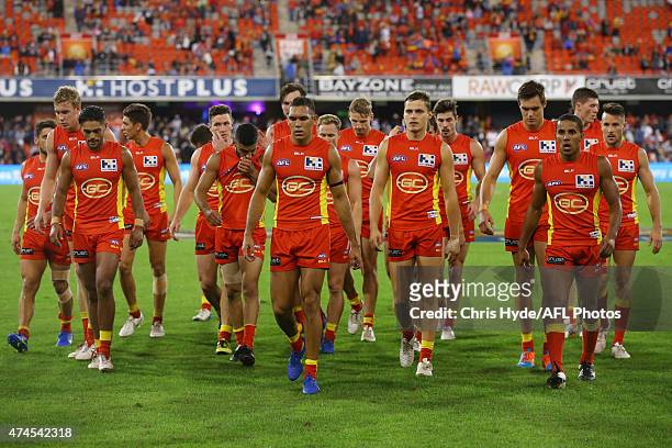 The Suns leave the field at half time during the round eight AFL match between the Gold Coast Suns and the Collingwood Magpies at Metricon Stadium on...