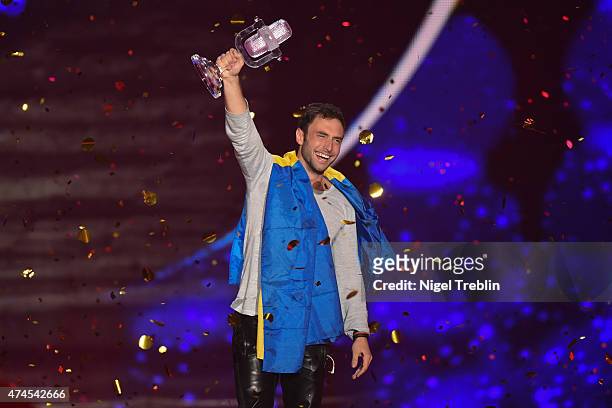 Mans Zelmerloew of Sweden reacts after winning on stage during the final of the Eurovision Song Contest 2015 on May 23, 2015 in Vienna, Austria. The...