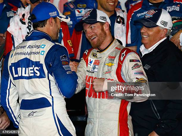 Dale Earnhardt Jr., driver of the National Guard Chevrolet, celebrates in Victory Lane with Jimmie Johnson, driver of the Lowe's Chevrolet, and team...