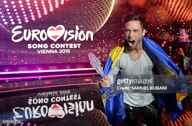 Sweden's Mans Zelmerlow reacts after winning the Eurovision Song Contest final on May 23, 2015 in Vienna. AFP PHOTO / SAMUEL KUBANI