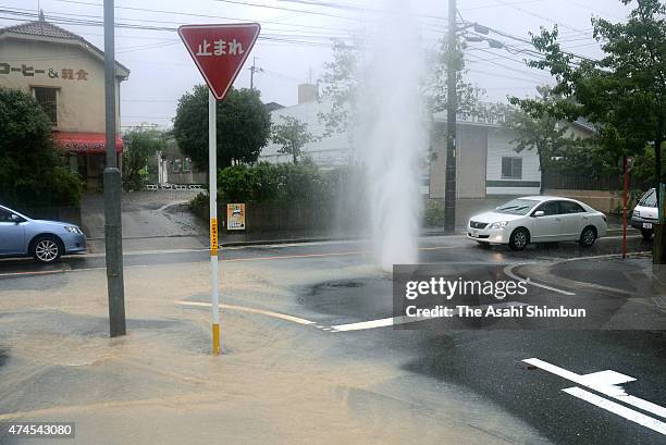 Water slpashes from a manhole as heavy rain triggered by Typhoon Roke hitting Nagoya on September 20, 2011 in Nagoya, Aichi, Japan. 16 people died of...
