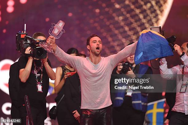 Mans Zelmerloew of Sweden reacts after winning on stage during the final of the Eurovision Song Contest 2015 on May 23, 2015 in Vienna, Austria. The...