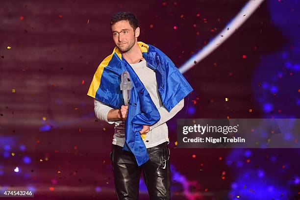 Mans Zelmerloew of Sweden reacts after winning on stage during the final of the Eurovision Song Contest 2015 on May 23, 2015 in Vienna, Austria. The...