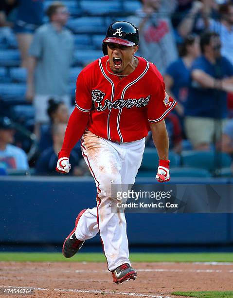 Jace Peterson of the Atlanta Braves reacts after hitting a walk-off RBI single in the 11th inning against the Milwaukee Brewers at Turner Field on...