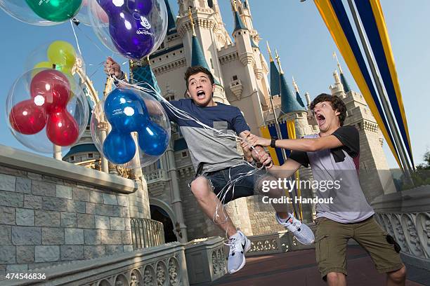 In this handout photo provided by Disney Parks, Disney XD's 'Mighty Med' stars Bradley Steven Perry and Jake Short pose in front of the Cinderella...
