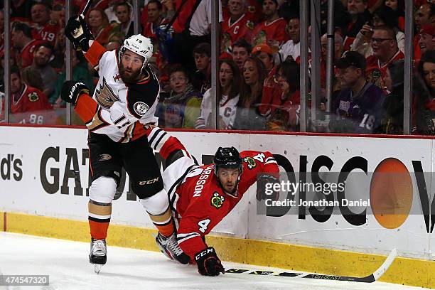 Patrick Maroon of the Anaheim Ducks checks Niklas Hjalmarsson of the Chicago Blackhawks in Game Four of the Western Conference Finals during the 2015...