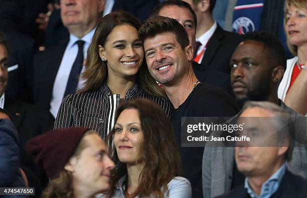 Robin Thicke and April Love Geary attend the French Ligue 1 match between Paris Saint-Germain and Stade de Reims at Parc des Princes stadium on May...