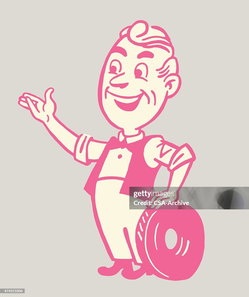 Man Holding Tire and Gesturing