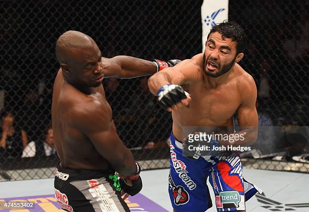 Rafael Natal of Brazil punches Uriah Hall in their middleweight bout during the UFC 187 event at the MGM Grand Garden Arena on May 23, 2015 in Las...