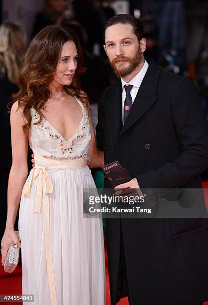 Kelly Marcel and Tom Hardy attend the EE British Academy Film Awards 2014 at The Royal Opera House on February 16, 2014 in London, England.