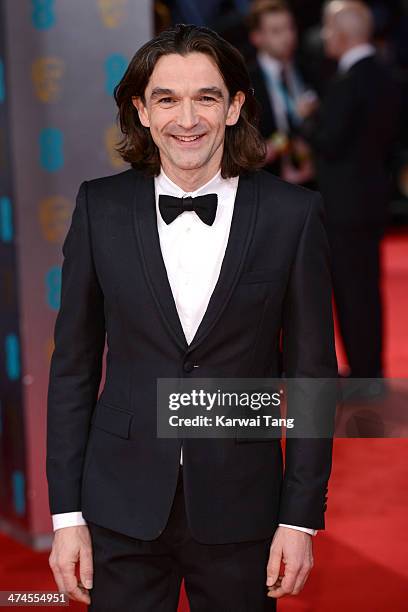 Justin Chadwick attends the EE British Academy Film Awards 2014 at The Royal Opera House on February 16, 2014 in London, England.