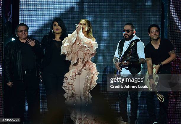 Jennifer Lopez performs musical tribute to Selena while performing with Los Dinos onstage at the 2015 Billboard Latin Music Awards presented by State...