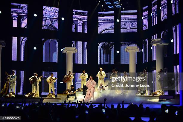 Jennifer Lopez performs musical tribute to Selena while performing with Los Dinos onstage at the 2015 Billboard Latin Music Awards presented by State...