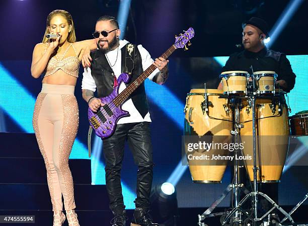 Jennifer Lopez performs musical tribute to Selena while performing with Los Dinos onstage at the 2015 Billboard Latin Music Awards presented by State...