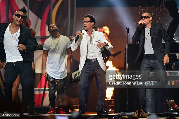 Marc Anthony and Gente de Zona performs at the 2015 Billboard Latin Music Awards presented by State Farm on Telemundo at Bank United Center on April...