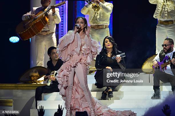 Jennifer Lopez performs musical tribute to Selena while performing with Los Dinos onstage at the 2015 Billboard Latin Music Awards presented by State...