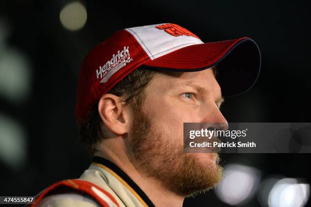 Dale Earnhardt Jr., driver of the National Guard Chevrolet, looks on in Victory Lane after winning the NASCAR Sprint Cup Series Daytona 500 at...