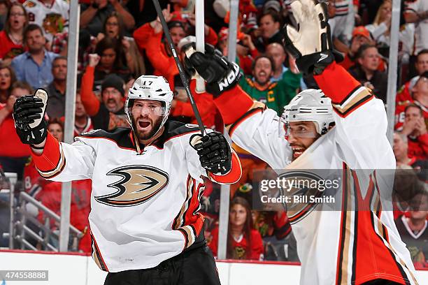 Ryan Kesler and Andrew Cogliano of the Anaheim Ducks react after Kesler scored against the Chicago Blackhawks in the third period in Game Four of the...