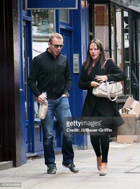 Olympic cyclist Chris Hoy and his wife Sarra Kemp are seen on October 16, 2012 in London, United Kingdom.