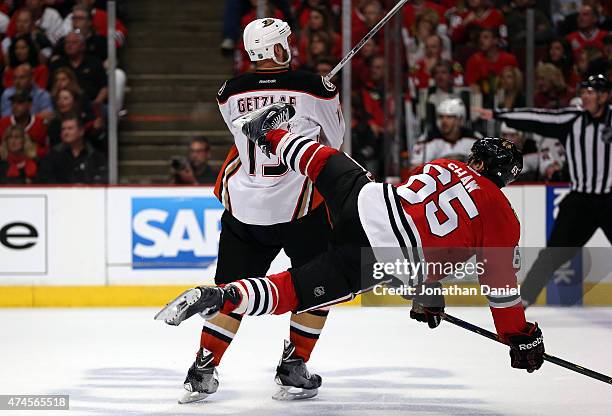 Ryan Getzlaf of the Anaheim Ducks checks Andrew Shaw of the Chicago Blackhawks in the third period of Game Four of the Western Conference Finals...