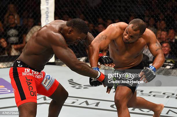 Daniel Cormier punches Anthony Johnson in their UFC light heavyweight championship bout during the UFC 187 event at the MGM Grand Garden Arena on May...