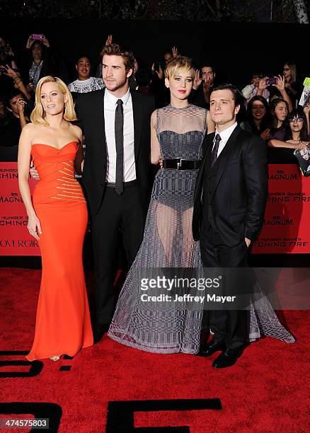 Actors Elizabeth Banks, Liam Hemsworth, Jennifer Lawrence and Josh Hutcherson arrive at the Los Angeles premiere of 'The Hunger Games: Catching Fire'...