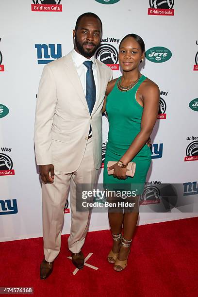 Jets Jaiquawn Jarrett and wife Charisma attend the 22nd Annual Gridiron Gala at New York Hilton Midtown on May 12, 2015 in New York City.