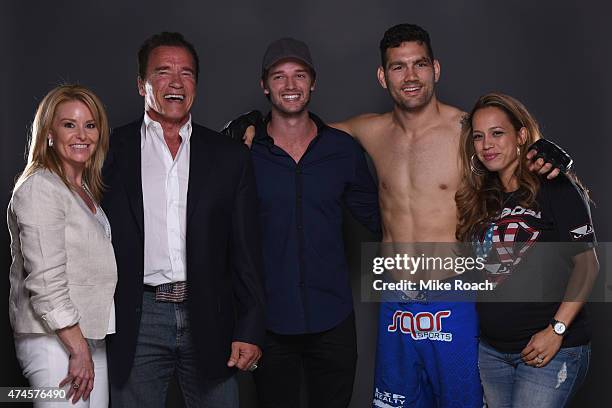 Heather Milligan, Arnold Schwarzenegger, Patrick Schwarzenegger, Chris Weidman and Marivi Weidman backstage during the UFC 187 event at the MGM Grand...