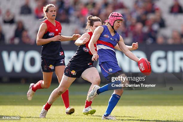 Heather Anderson of the Bulldogs kicks the ball during the Women's AFL exhibition match between the Melbourne Demons and the Western Bulldogs at...