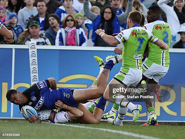 Curtis Rona of the Bulldogs scores a try during the round 11 NRL match between the Canberra Raiders and the Canterbury Bulldogs at GIO Stadium on May...