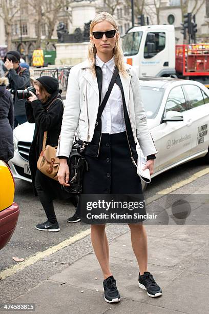 Model Karolina Kurkova wears a vintage leather jacket, a Michael Kors skirt, A.O.T.C. By Curve shirt, Adidas trainers on day 4 of London Collections:...